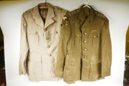 Two Royal Army Service Corps uniform jackets with buttons and insignia