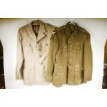 Two Royal Army Service Corps uniform jackets with buttons and insignia