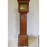 A C18th oak long case clock, the brass dial with engraved chapter ring and enamelled Roman numerals,