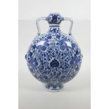 A Chinese blue and white porcelain garlic head flask with two handles and decorated with a