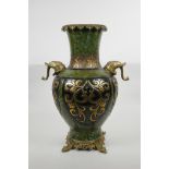 A Chinese mottled green ground pottery vase with ormolu style mounts and elephant mask handles,