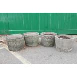 A set of four concrete half barrel planters, 16" high x 12" diameter