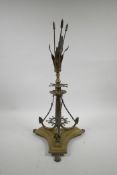 An unusual brass centrepiece on a triform base with nautical decoration, 19½" high, A/F