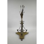 An unusual brass centrepiece on a triform base with nautical decoration, 19½" high, A/F