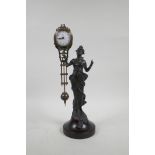 A bronzed metal and brass mystery clock, the body in the form of a woman in flowing robes, 13" high