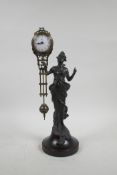 A bronzed metal and brass mystery clock, the body in the form of a woman in flowing robes, 13" high