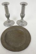 An C18th pewter plate with London touch marks, 8" diameter, together with a pair of Regency