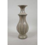 A Chinese crackle glazed pottery vase with a ribbed body, impressed mark to base, 12½" high