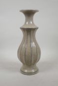 A Chinese crackle glazed pottery vase with a ribbed body, impressed mark to base, 12½" high