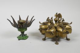 An Indian brass six section tikka box with peacock decoration, together with an incense holder