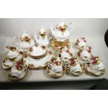 A Royal Albert Old Country Rose porcelain double service comprising two teapots, coffee pot, cream