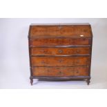 An Italian C18th burr yew bureau with a fold down top and fitted interior over three serpentine