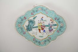 A Chinese famille rose porcelain pedestal dish with a shaped rim, decorated with children and