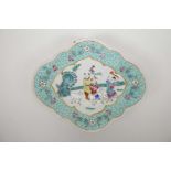 A Chinese famille rose porcelain pedestal dish with a shaped rim, decorated with children and
