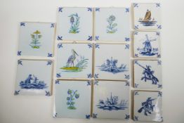 Twelve Delft tiles, hand decorated with traditional designs, eight x 5" square tiles, four x 4"