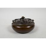 A Chinese bronze censer and pierced cover with a loop handle, impressed seal mark to base, 4"