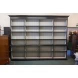 A painted two section open bookcase, 138" wide x 104" high