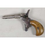 An antique pin fire purse pistol with polished wood handle, the barrel drilled and plugged, 4½?