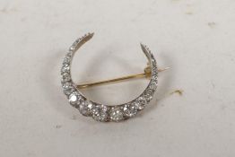 A fine antique yellow metal crescent brooch set with well cut diamonds, approx 3ct, 1¼? diameter, 4g