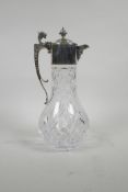 A moulded glass claret jug with silver plated mounts, 12" high
