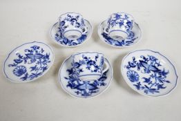 Three Meissen 'Onion' pattern cups with twist handles and five saucers