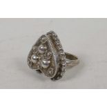 A sterling silver heart shaped poison ring with beaded decoration, size S