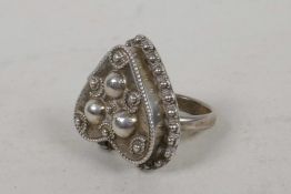 A sterling silver heart shaped poison ring with beaded decoration, size S