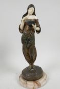 A late C19th bronze and faux ivory figure of a beautiful girl dressed in Arab clothing looking in