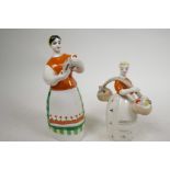 A 1950s Russian USSR Ukranian ZHK Polonne porcelain figure of a girl with a yoke, stamped to base,