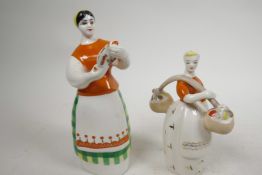 A 1950s Russian USSR Ukranian ZHK Polonne porcelain figure of a girl with a yoke, stamped to base,