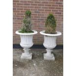 A pair of painted cast iron garden urns, 30" high x 23" diameter