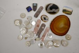 A collection of mother of pearl buttons, mineral samples etc