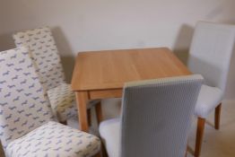A modern oak table and four upholstered high back chairs, 33½" x 33½", 31" high