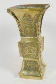 A Chinese bronze square section Gu shaped vase with engraved decoration, 7½" high