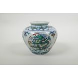 A Chinese doucai porcelain pot decoration with a dragon and flaming pearl, six character mark to