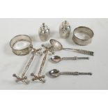 A collection of hallmarked silver to include two napkin rings, salt and pepper with chased