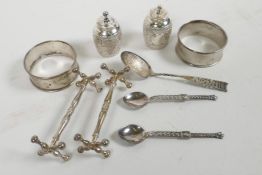 A collection of hallmarked silver to include two napkin rings, salt and pepper with chased