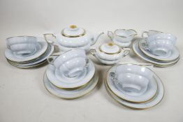 A Swedish Gefle porcelain tea service with pale blue glaze and gilt embellishments 'Grand' design