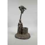 A silver plated centrepiece in the form of a Moor by a well, 15" high