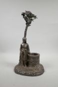 A silver plated centrepiece in the form of a Moor by a well, 15" high