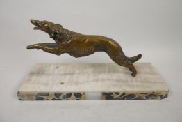 A bronze model of a hound running, mounted on a marble plinth, 10" long