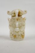 A Chinese reconstituted jade mask ornament, 7"