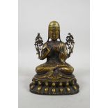A Sino Tibetan bronze Buddha seated on a lotus throne, with inset stone decoration, 7" high