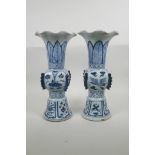 A pair of Chinese blue and white porcelain Ming style gu vases with frilled rims, decorated with
