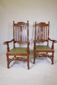 A pair of French late C19th/early C20th oak open armchairs with carved and pierced backs, raised