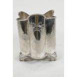 A silver plated champagne coaster of ribbed design engraved with floral garlands and vacant shields,