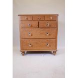 A C19th Dutch pine chest of three drawers over two drawers over two more, with scumble glaze