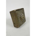 A Tibetan travelling brass prayer box with repousse decoration, 3" x 3½"