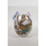 A Chinese polychrome porcelain vase decorated with an iron red and gilt dragon in clouds, and