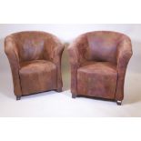 A pair of brown suede style tub chairs, 33" high